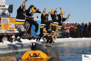 folks jump in lake at eelpout festival