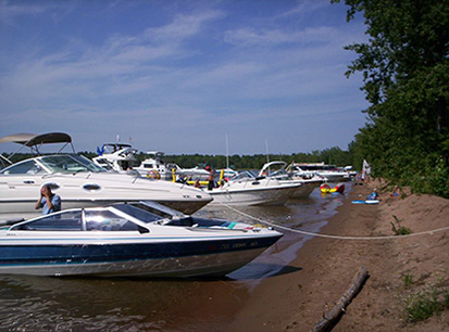 Boats docked on the beach