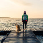 Woman and dog on dock